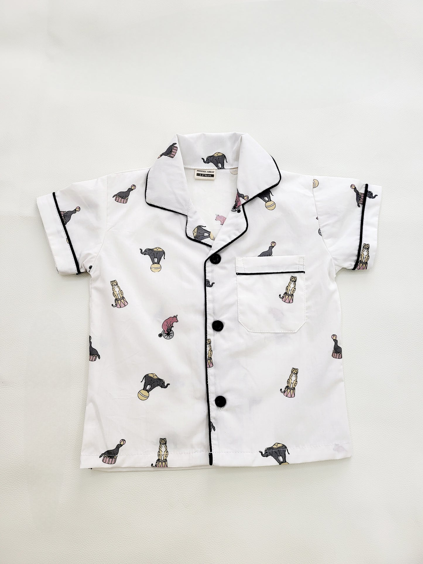 Animal Parade night suit set, featuring a white base with cute elephant and circus print, designed for kids who love animals and the circus, and want to sleep in comfort and style