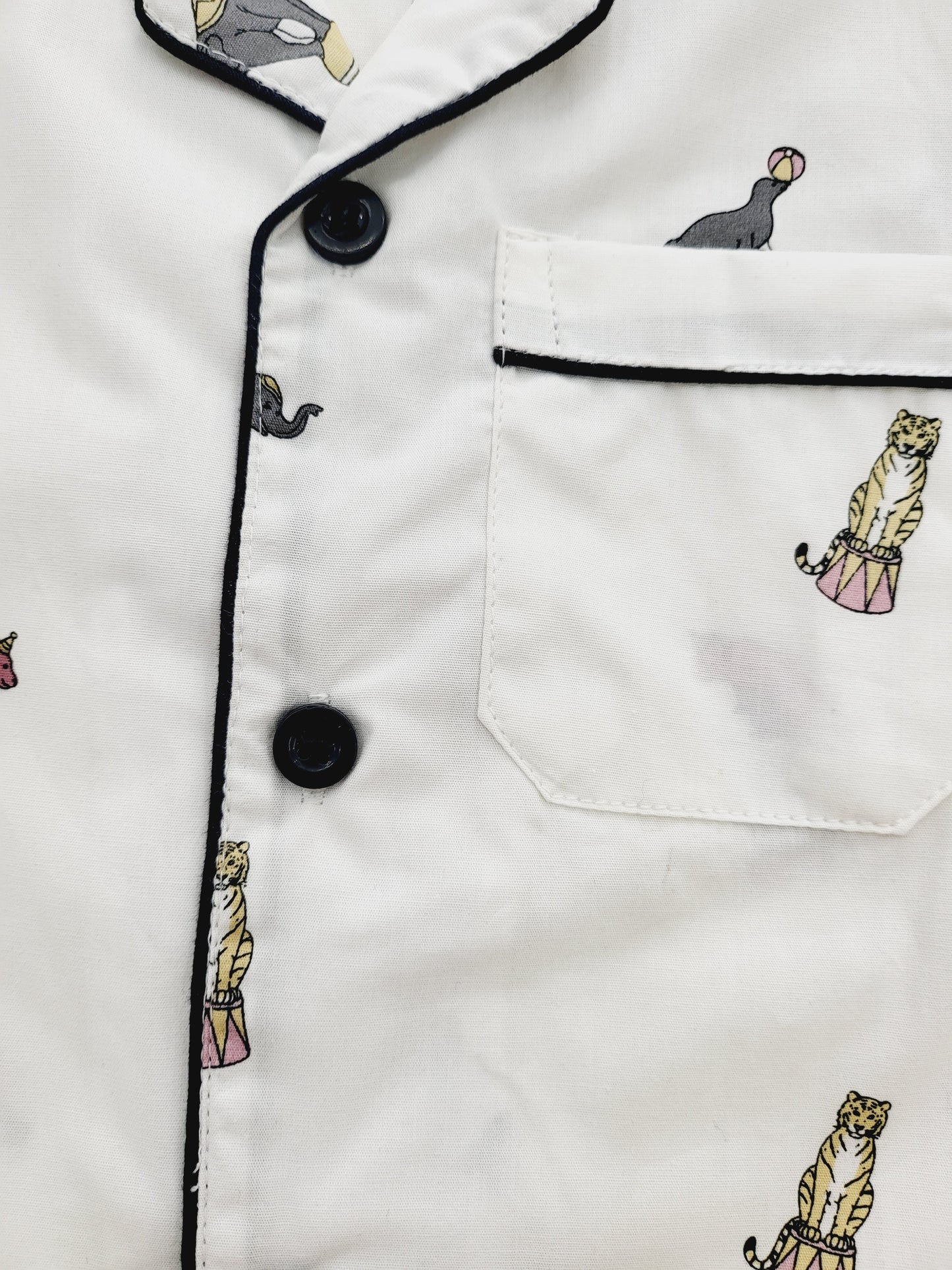 Short sleeve nightsuit with pyjama, featuring a white base with cute elephant and circus print, designed for kids who love comfort and style, and want to sleep in a fun and adventurous night suit
