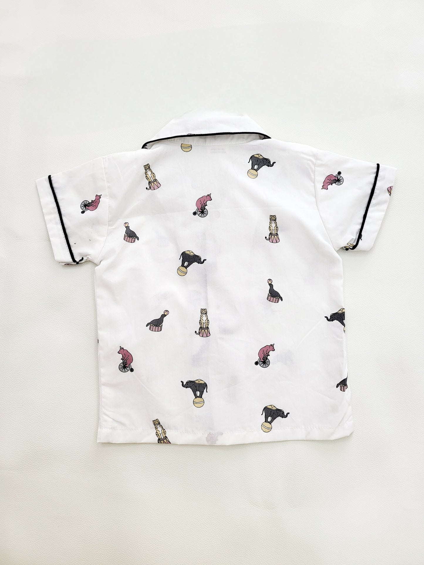 Animal Parade night suit set, featuring a white base with cute elephant and circus print, designed for kids who love animals and the circus, and want to sleep in comfort and style