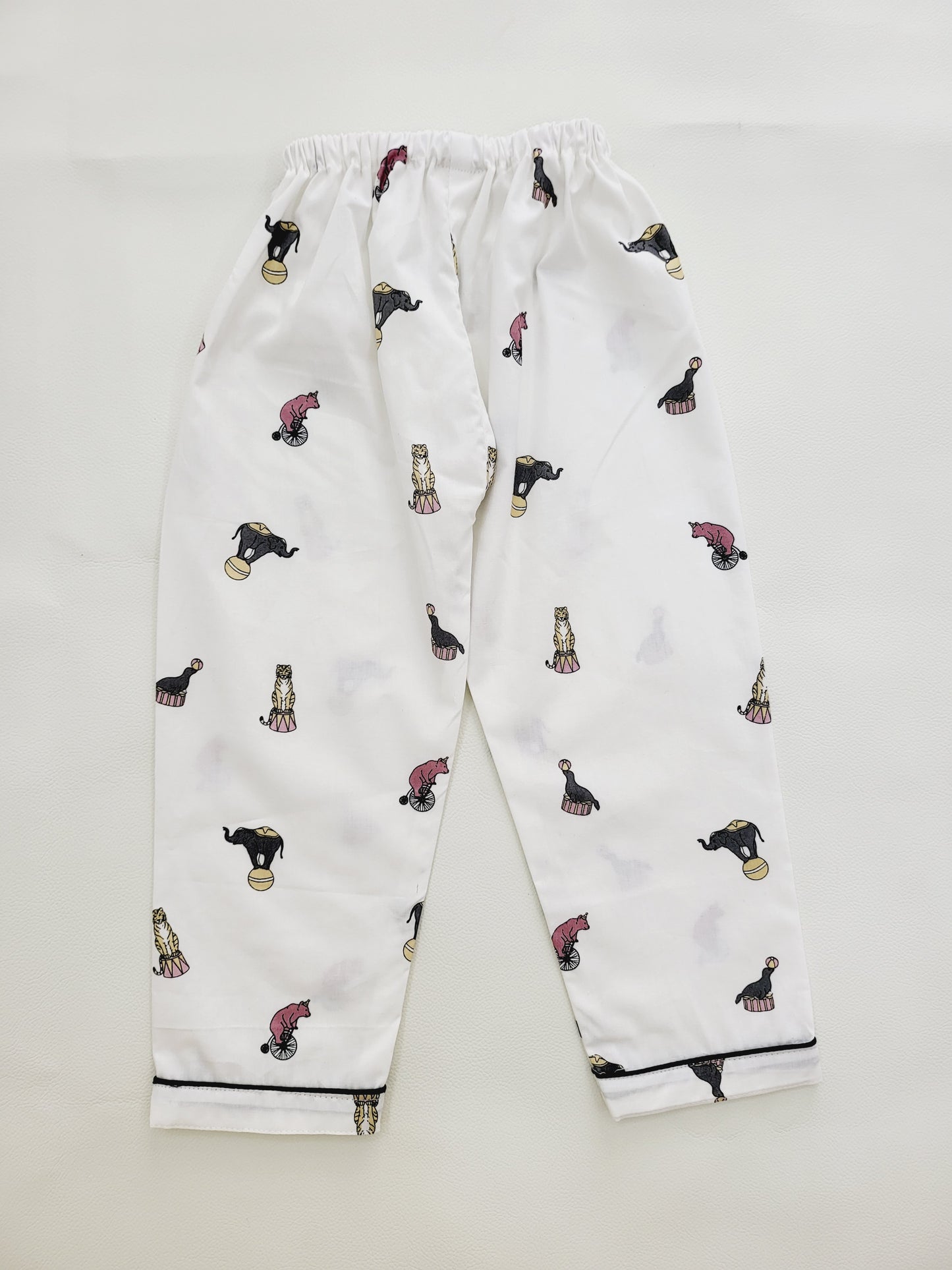 Unisex cotton night suit set with white base and colorful elephant and circus print, featuring a fun and playful design, ideal for kids who love animals and fantasy
