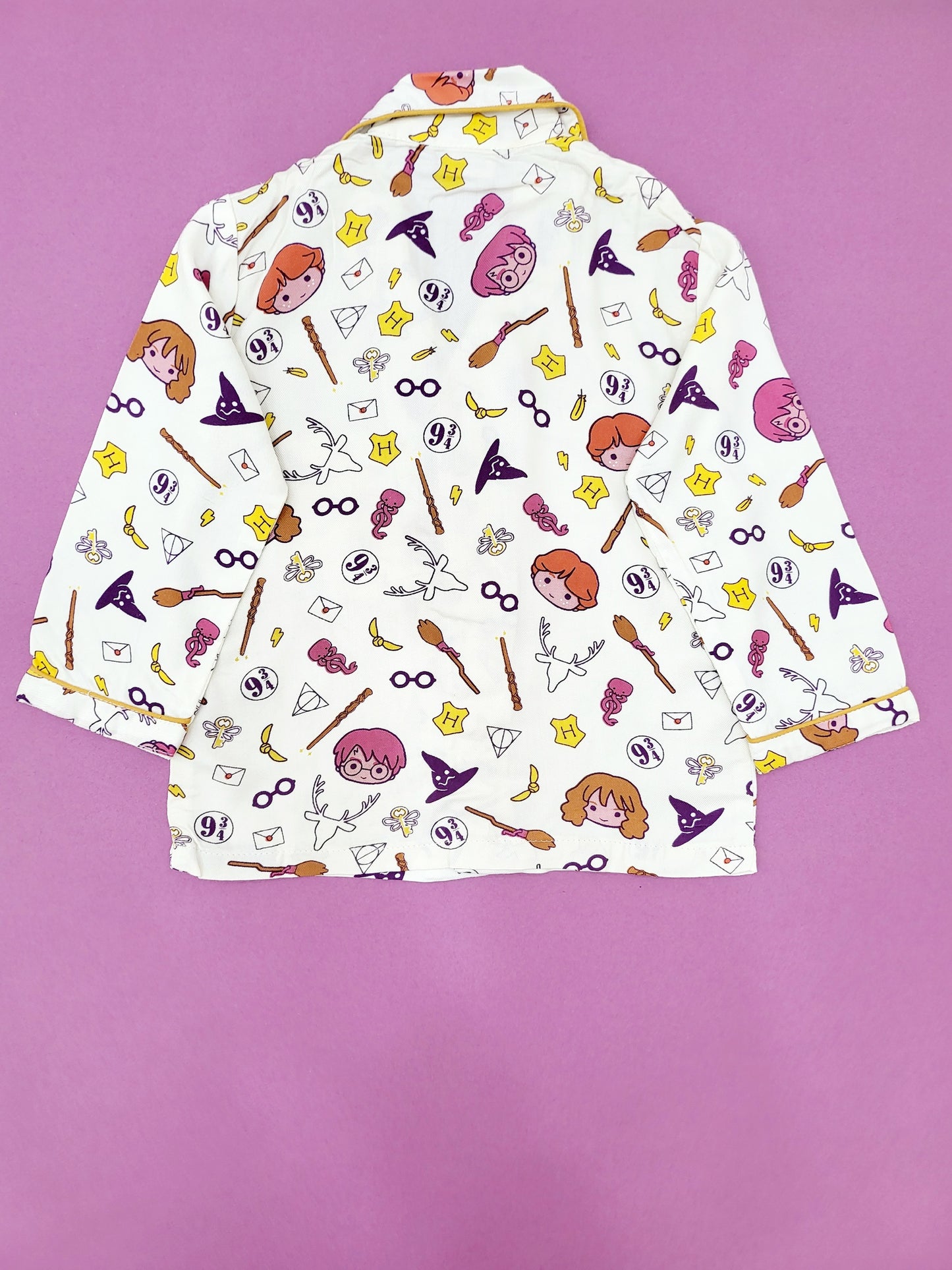 Back view of the Harry Potter nightsuit, featuring a repeating pattern of harry porter, his wand and a witches hat, made from breathable cotton, ideal for kids who love the wizarding world