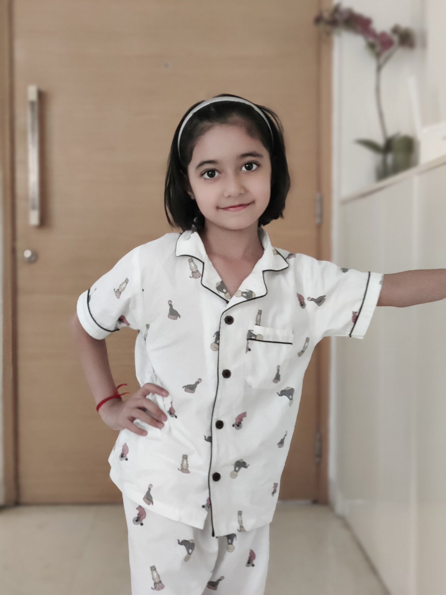 Unisex cotton night suit set with white base and cute elephant and circus print, featuring a fun and playful Animal Parade design, perfect for kids who love animals and adventure