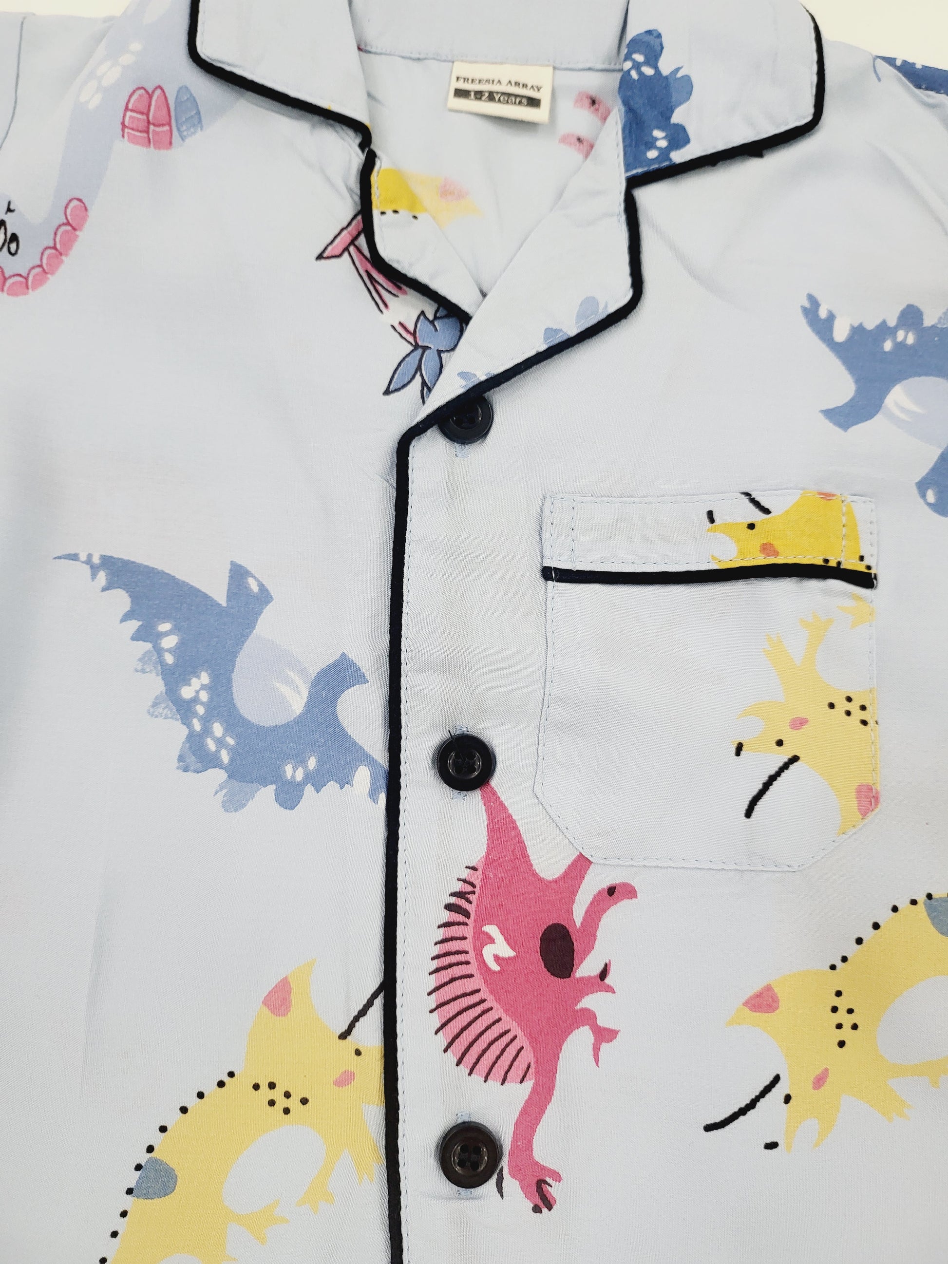 comfortable and cozy sky blue nightsuit with colorful dinosaur print, made from soft rayon material, suitable for kids from 1 to 14 years old