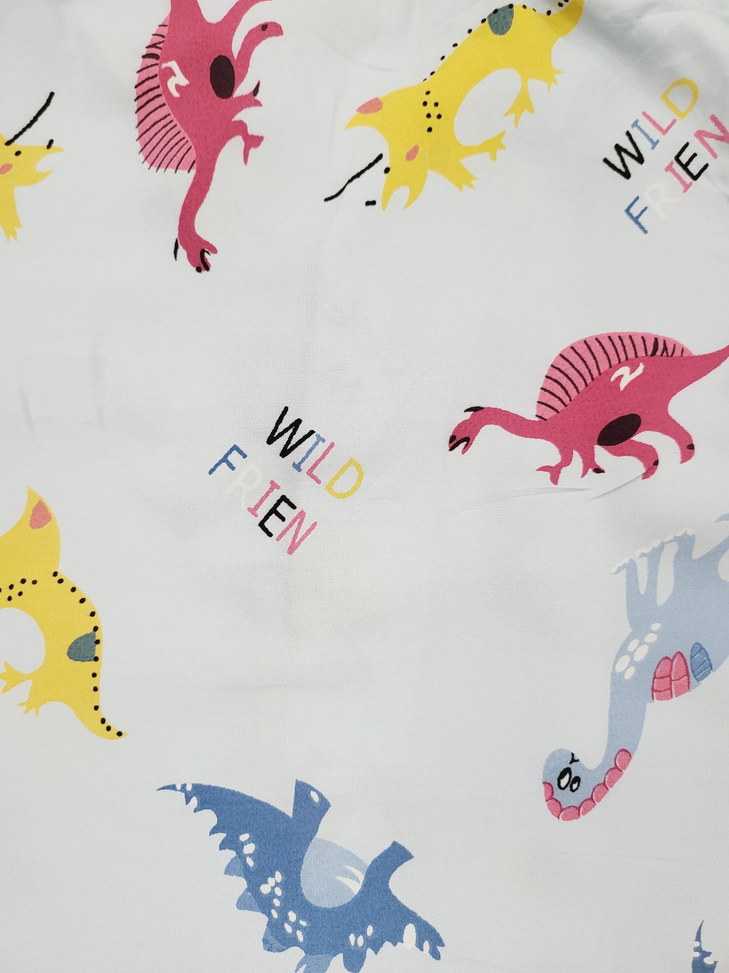 Prehistoric sky blue unisex nightsuit with colorful dinosaur print, designed for boys and girls aged 1-14 years, for a fun and exciting sleep filled with roaring adventures and sweet dreams