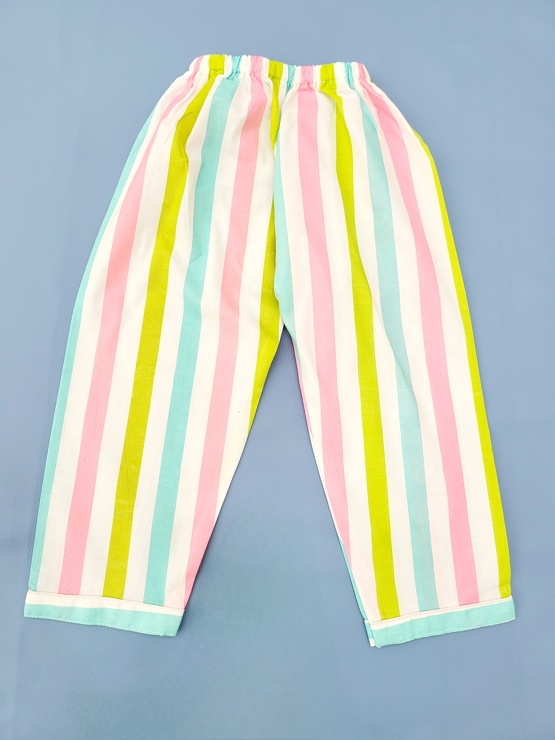 White base nightsuit with colorful stripe print, a perfect choice for kids who love colorful and lively designs, and want to wear their favorite pattern to bed