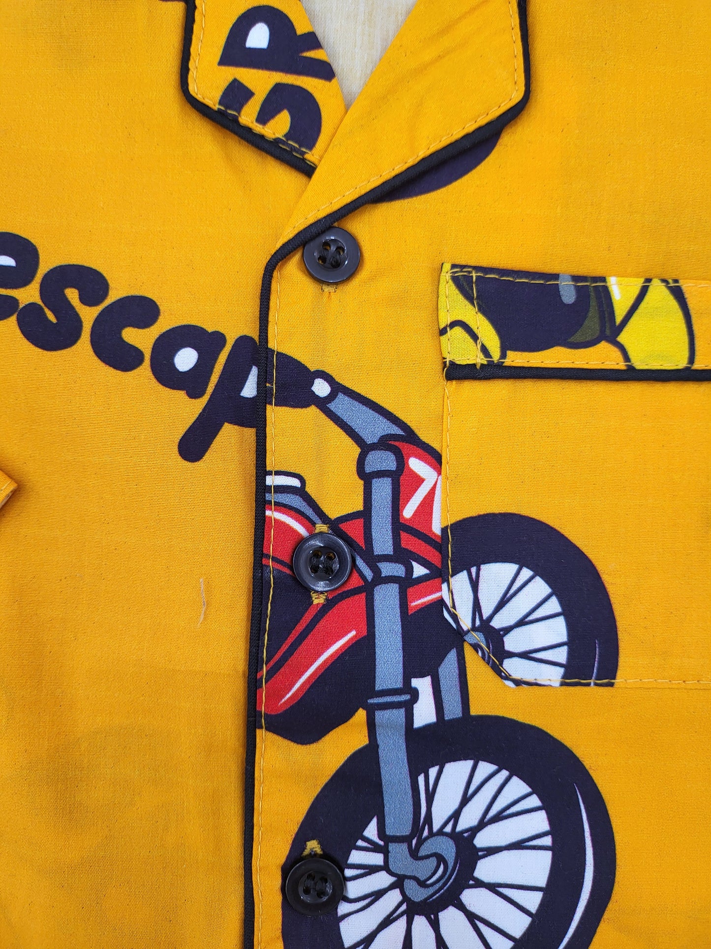 Unisex nightsuit in bright dark yellow with bold black bike print, perfect for kids from infancy to teens