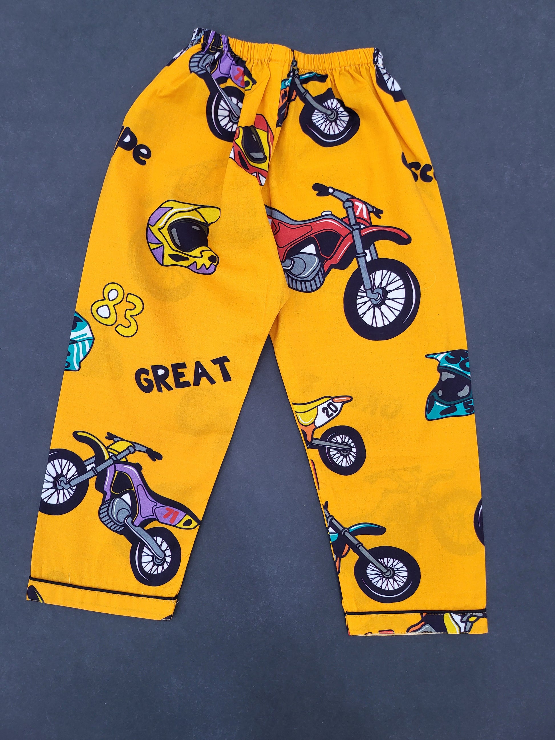 Dark yellow full sleeve nightsuit with black bike print, a great sleep solution for kids who love adventure and cycling