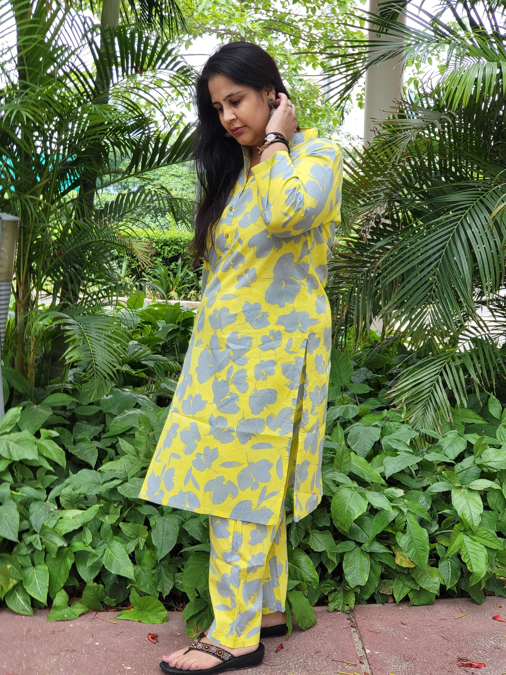 shop contemporary Indian ethnic wear, featuring a vibrant yellow floral patterned kurta and pants