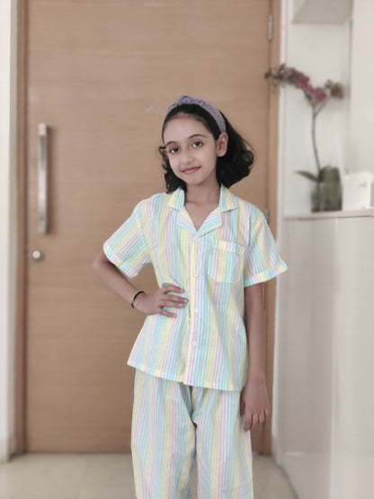 White Peace Palette Night Suit Set with multicolor stripes, a unisex cotton sleepwear option with short sleeves and pyjama, ideal for kids and adults alike